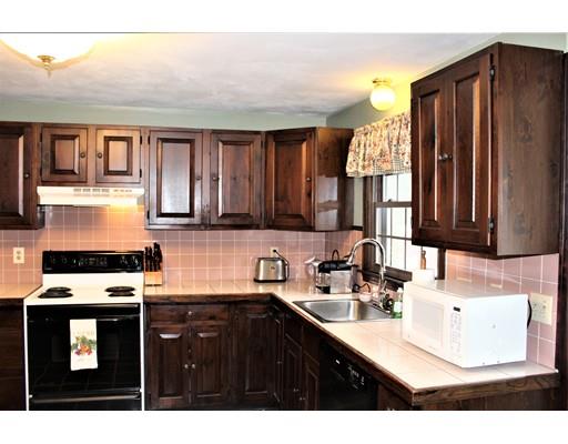 8 Meadowbrook Road Franklin, MA 02038 - Photo 4 of 11 a kitchen with stainless steel appliances granite countertop a sink stove and refrigerator