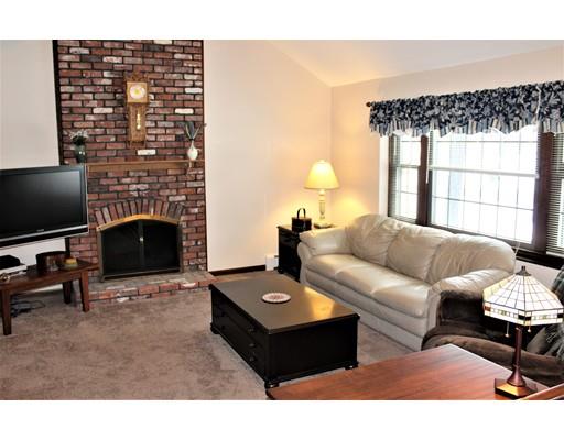 8 Meadowbrook Road Franklin, MA 02038 - Photo 7 of 11 a living room with furniture and a fireplace