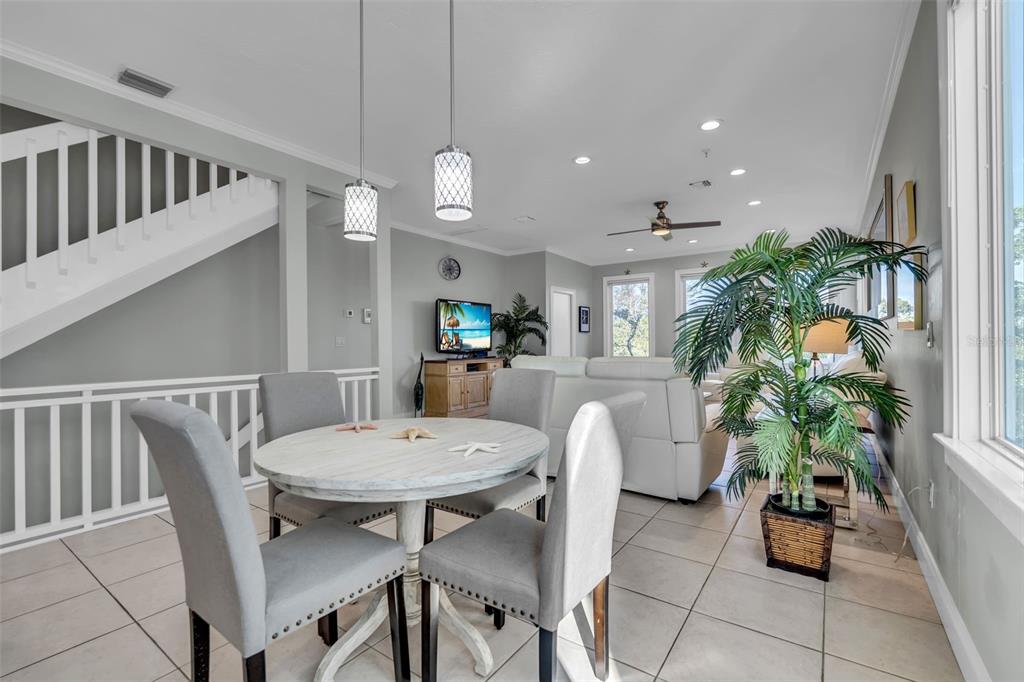 848 Evergreen Way Longboat Key, FL 34228 - Photo 4 of 66 a view of a dining room with furniture and a potted plant