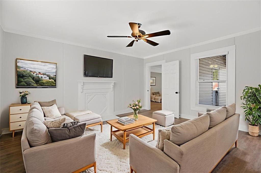 246 Spring Street Commerce, GA 30529 - Photo 17 of 23 a living room with furniture and a flat screen tv