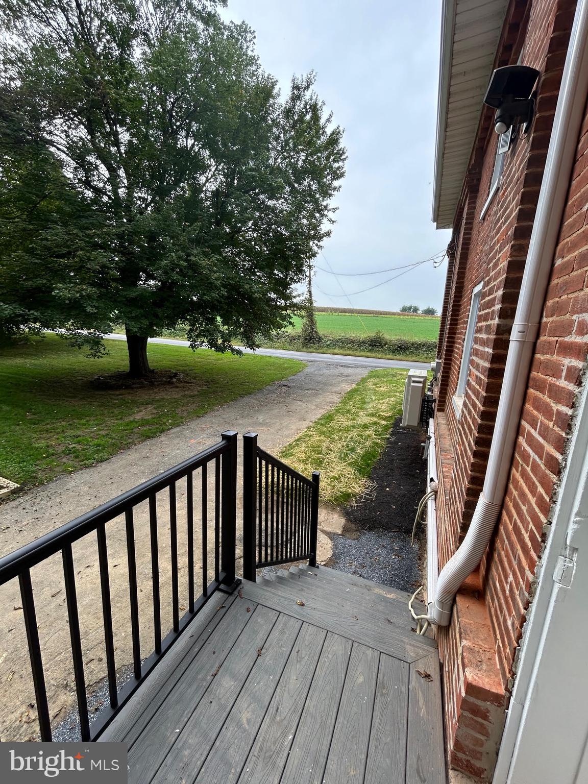 1355 Penn Grant Road, Unit 2 Strasburg, PA 17579 - Photo 12 of 13 a view of a balcony with wooden floor and outdoor space