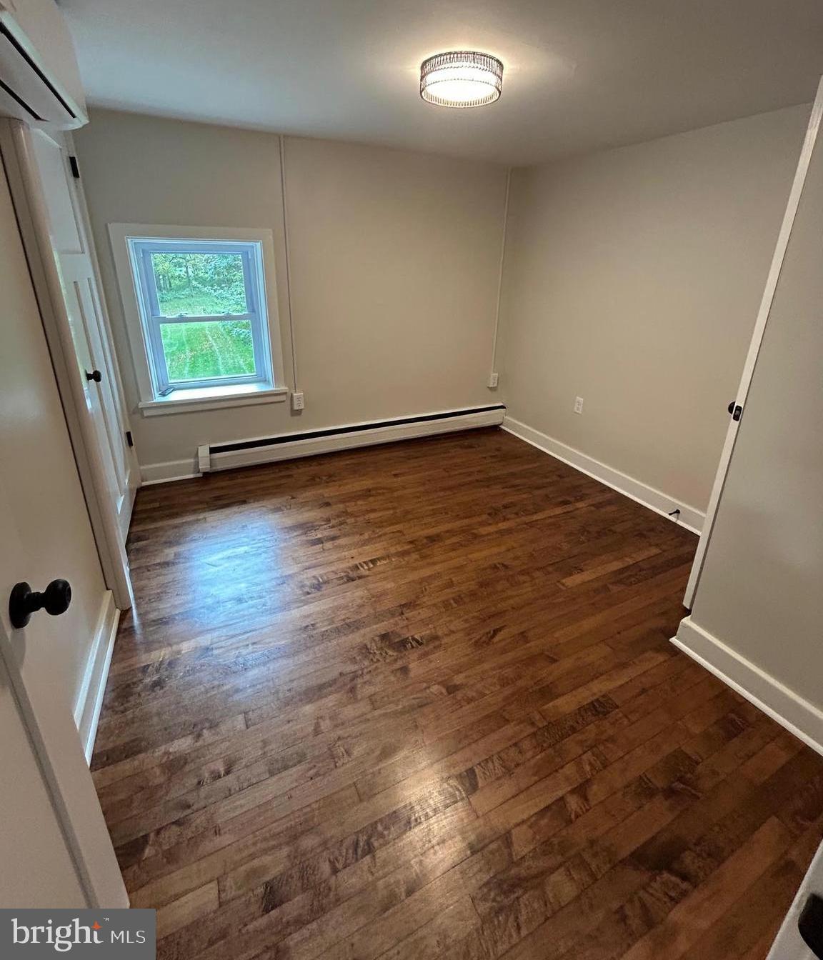 1355 Penn Grant Road, Unit 2 Strasburg, PA 17579 - Photo 7 of 13 a view of a room with wooden floor and window