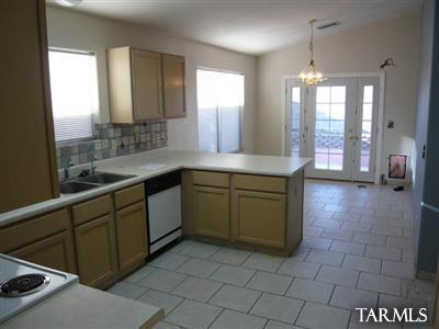 7828 South Lauder Street Tucson, AZ 85747 - Photo 3 of 11 a large kitchen with a sink and cabinets