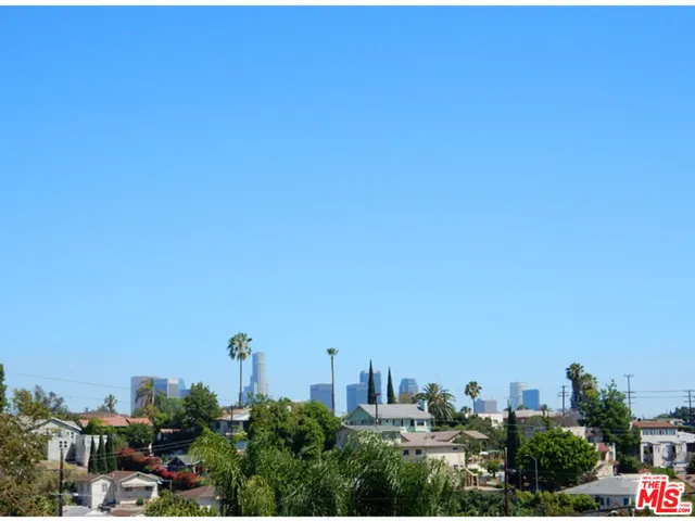 a view of a city with a building in the background