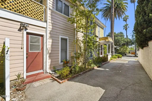 a view of path along with house and trees