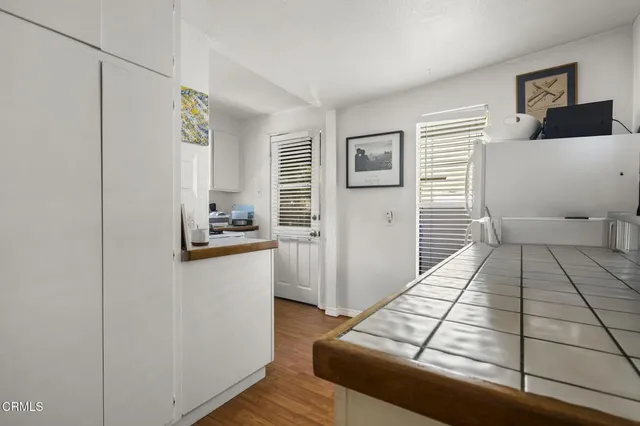 a view of a livingroom with wooden floor