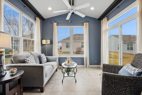 a living room with furniture and a large window