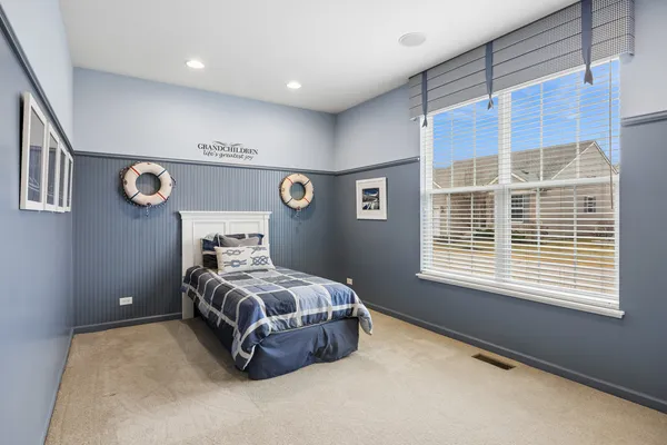 a room with a bed and a window