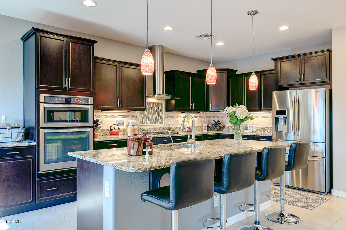4432 North 155th Lane Goodyear, AZ 85395 - Photo 15 of 62 Stagered Cabinets Granite Countertops