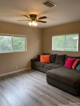 a living room with furniture and a large window
