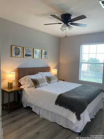 a bedroom with a bed and window