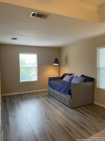 a bedroom with a bed and window