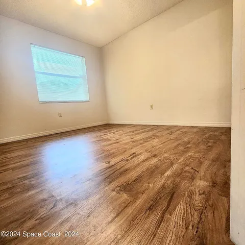 a bathroom with a toilet a sink and shower