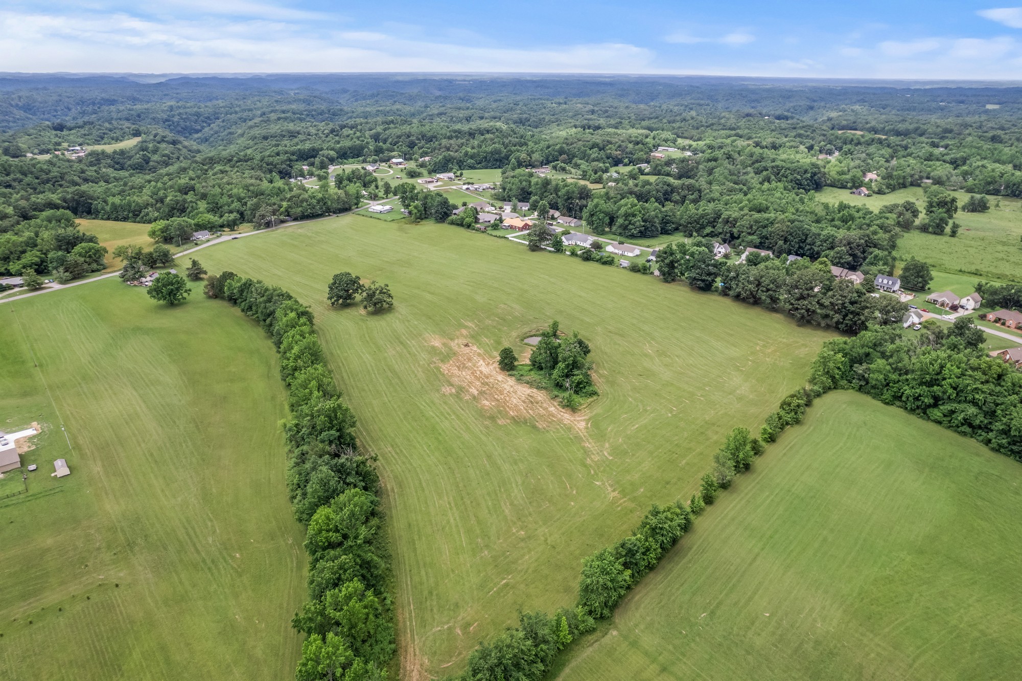 0 Hulon Ferrell Road Baxter, TN 38544 - Photo 16 of 25 a view of a lake with a yard
