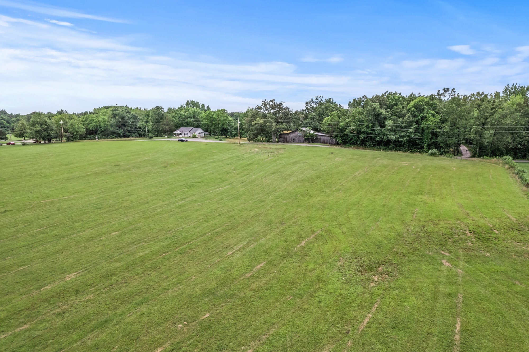 0 Hulon Ferrell Road Baxter, TN 38544 - Photo 4 of 25 a view of a green field with wooden fence