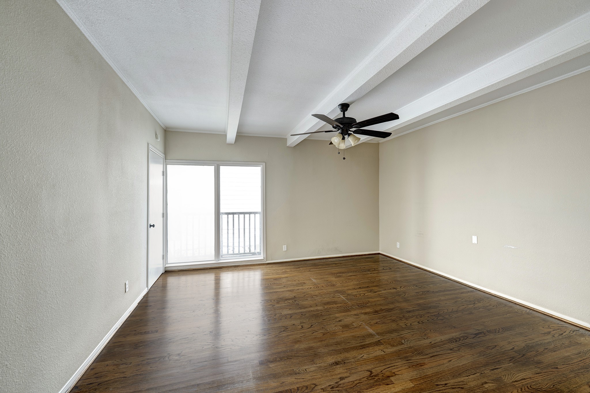 1122 Autrey Street, Unit 5 Houston, TX 77006 - Photo 17 of 32 Second of two large upstairs bedrooms, same dimensions as the other. Large glass door to balcony and beautiful hardwood flooring.