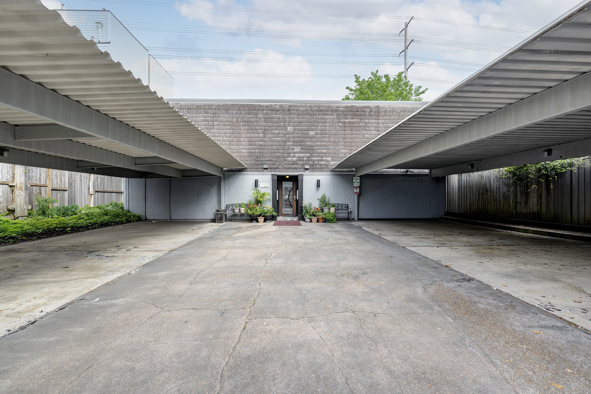 1122 Autrey Street, Unit 5 Houston, TX 77006 - Photo 20 of 32 Covered parking for each condo just steps from the locked main entrance to the complex. Wonderful in bad weather and for safety.