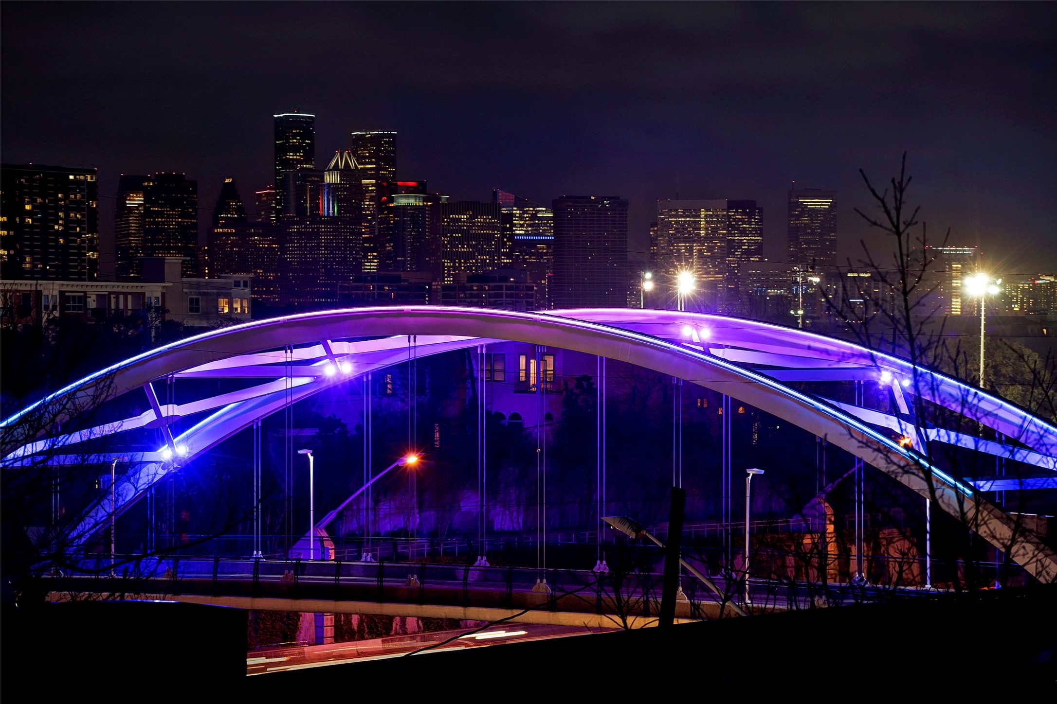 1122 Autrey Street, Unit 5 Houston, TX 77006 - Photo 32 of 32 Nightime view of one of five architecturally distinctive bridges over I 69 with Downtown in background.