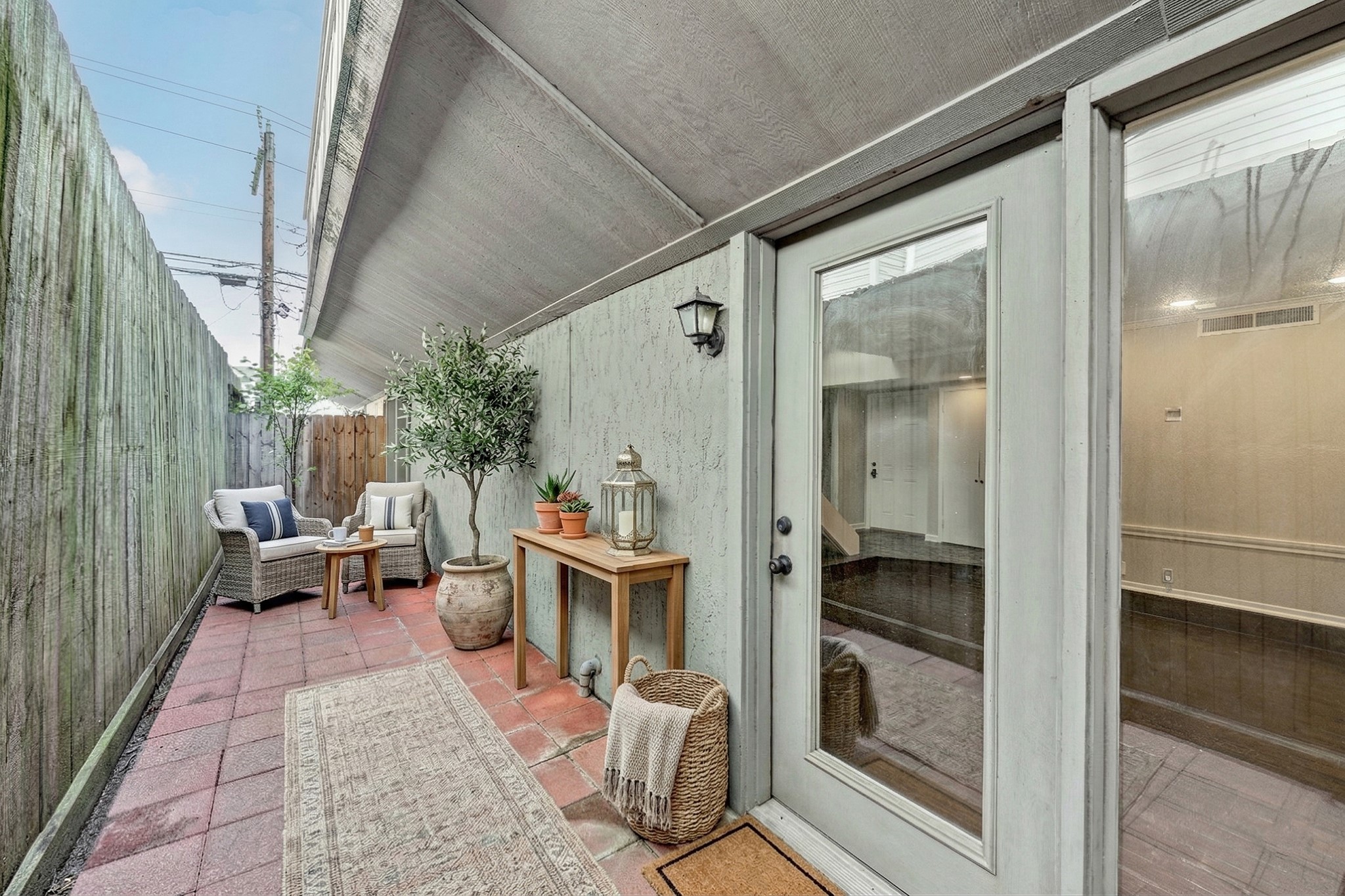 1122 Autrey Street, Unit 5 Houston, TX 77006 - Photo 4 of 32 Large Private tiled patio with living room and dining room access. Wonderful oasis to read and relax or entertain friends. Virtually Staged.