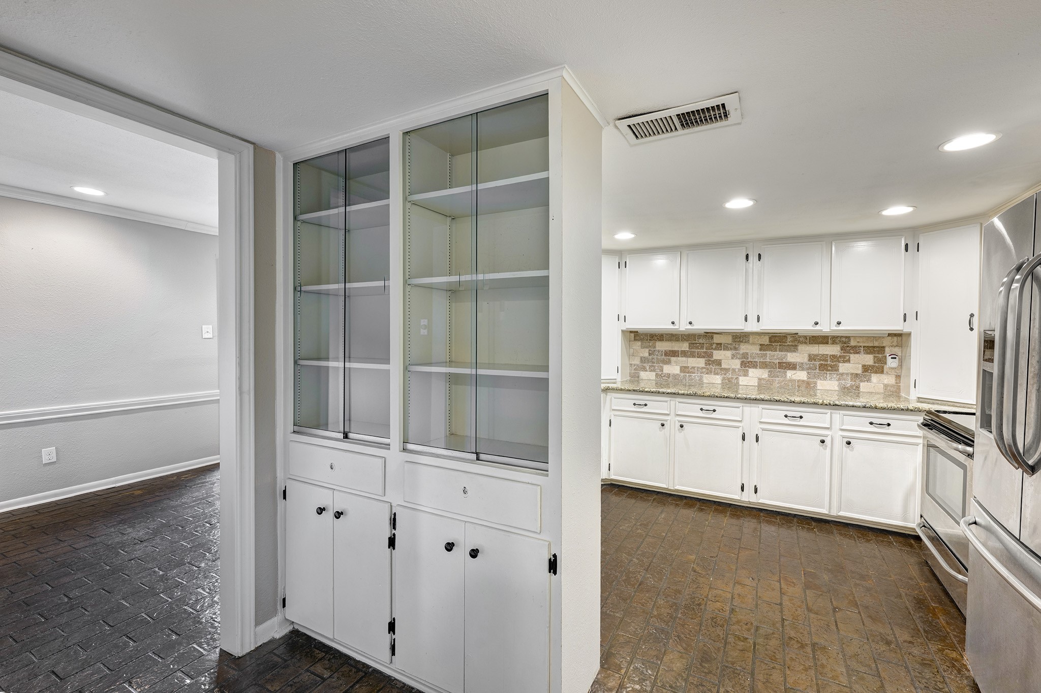 1122 Autrey Street, Unit 5 Houston, TX 77006 - Photo 5 of 32 Storage everywhere. Built in china cabinets in hall between kitchen and dining room.