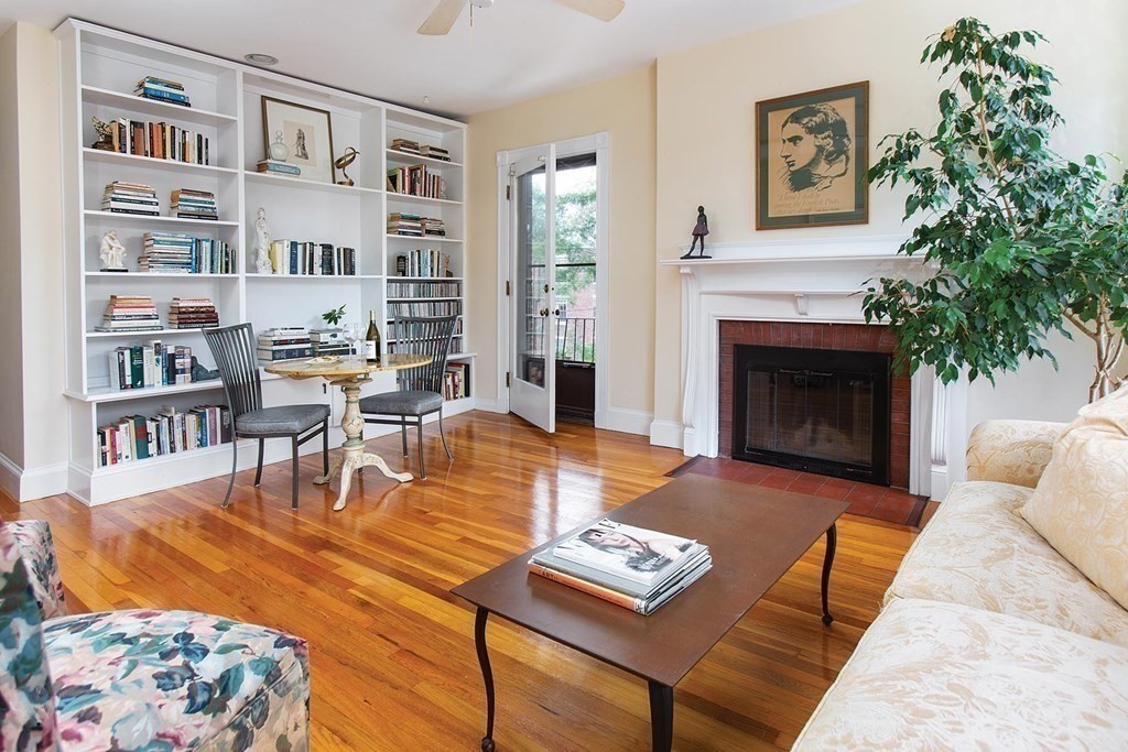 1 Regent Circle, Unit 2 Brookline, MA 02445 - Photo 2 of 10 a living room with furniture and a fireplace