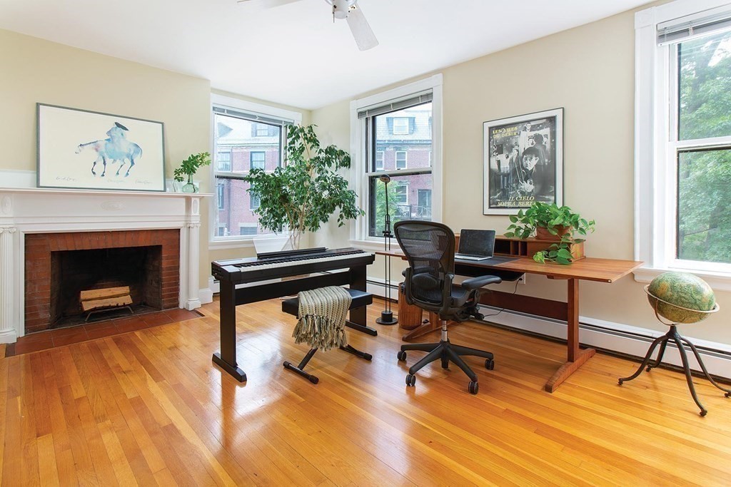 1 Regent Circle, Unit 2 Brookline, MA 02445 - Photo 6 of 10 a living room with furniture and a fireplace
