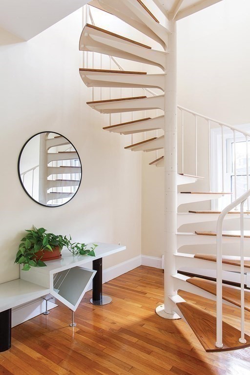 1 Regent Circle, Unit 2 Brookline, MA 02445 - Photo 8 of 10 a room with a bench and a potted plant