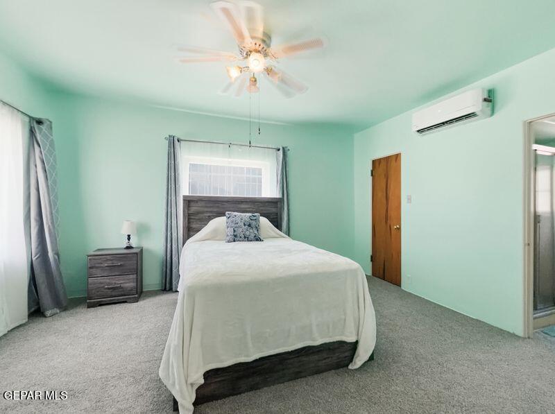 4135 Emory Road El Paso, TX 79922 - Photo 56 of 73 a bedroom with a bed and a chandelier