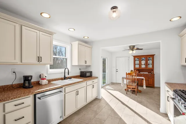a kitchen with a sink and cabinets