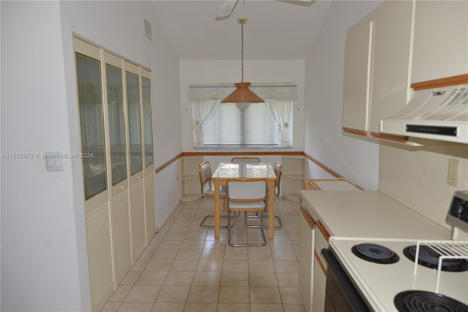Ives Estates Miami, FL 33179 - Photo 2 of 17 a living room with a couch and a table with wooden floor