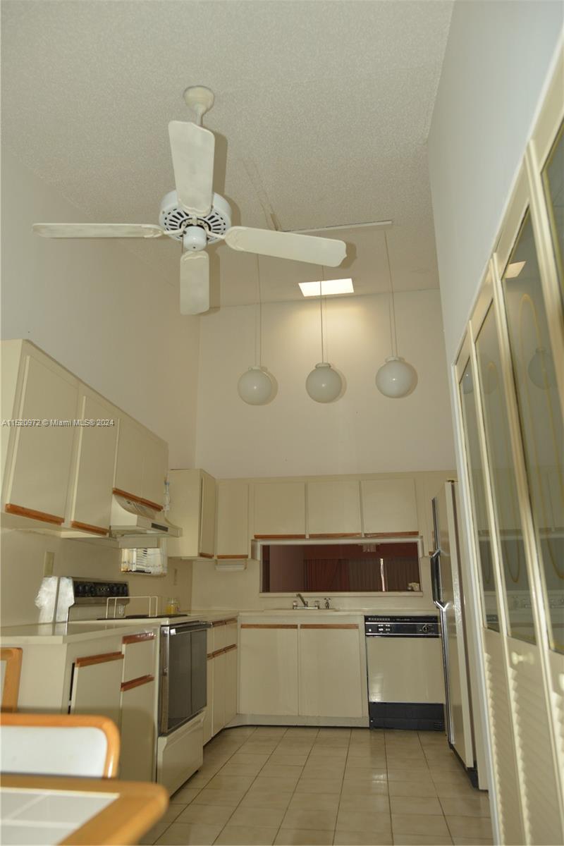 Ives Estates Miami, FL 33179 - Photo 3 of 17 a kitchen with a sink and stainless steel appliances