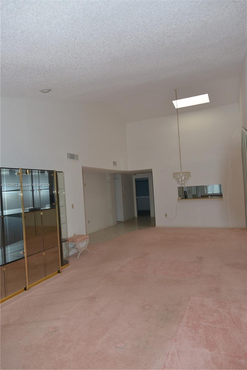Ives Estates Miami, FL 33179 - Photo 7 of 17 a view of an empty room with a fireplace