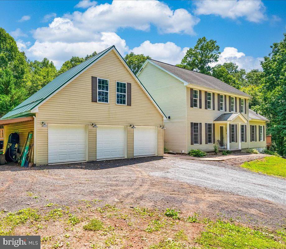 14145 Roberts Road Hancock, MD 21750 - Photo 55 of 69 a front view of a house with a garden and yard