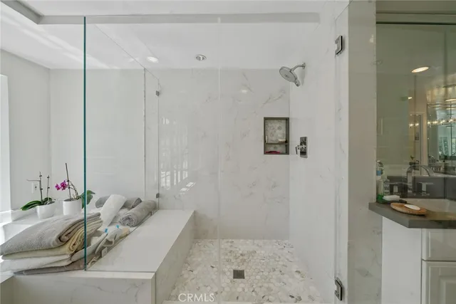 a white bath tub sitting next to a window