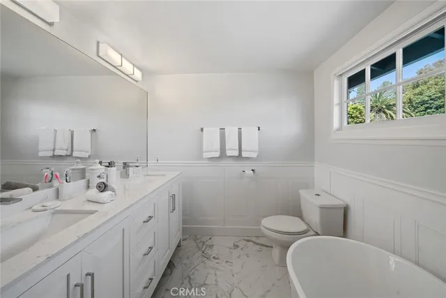 a bathroom with a shower and toilet