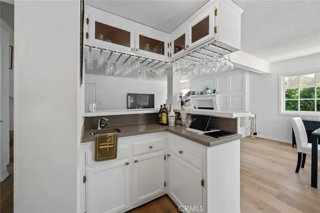 a view of dining table chairs and window