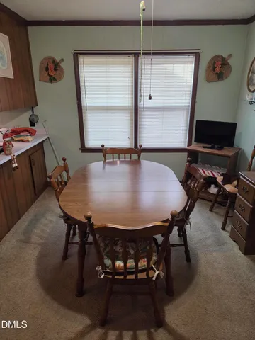 a view of a dining room with furniture
