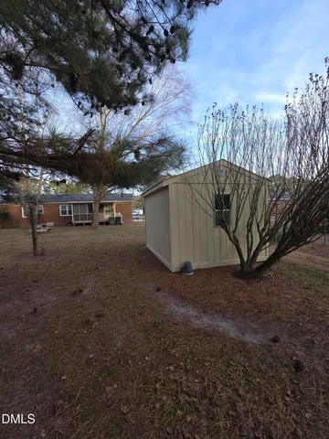 a view of a backyard of the house