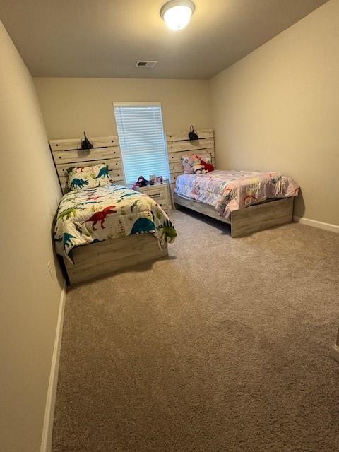 357 Indian Lake Trail Villa Rica, GA 30180 - Photo 13 of 26 a bedroom with a bed and gym equipment