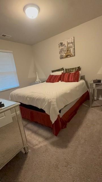 357 Indian Lake Trail Villa Rica, GA 30180 - Photo 18 of 26 a bedroom with a bed and window