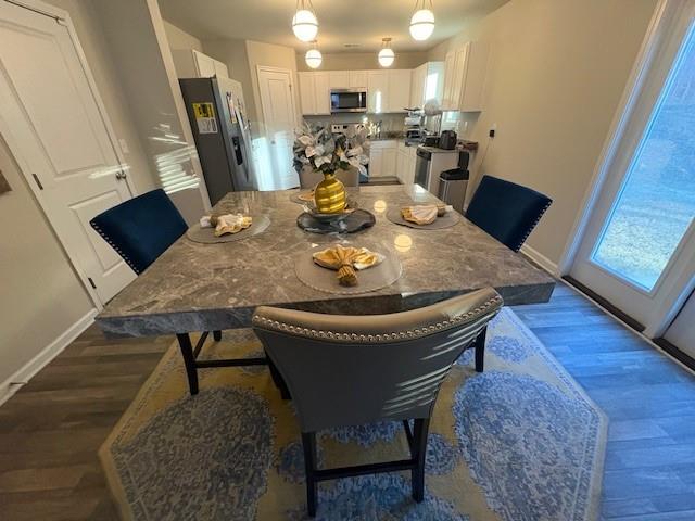 357 Indian Lake Trail Villa Rica, GA 30180 - Photo 2 of 26 a view of a dining room with furniture and wooden floor