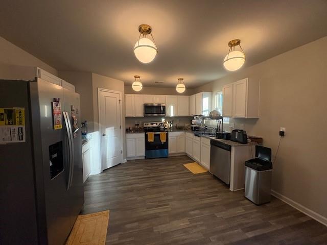 357 Indian Lake Trail Villa Rica, GA 30180 - Photo 5 of 26 a kitchen with a refrigerator and a stove top oven