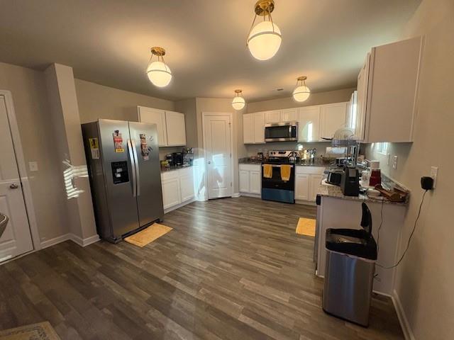 357 Indian Lake Trail Villa Rica, GA 30180 - Photo 6 of 26 a kitchen with refrigerator and chairs