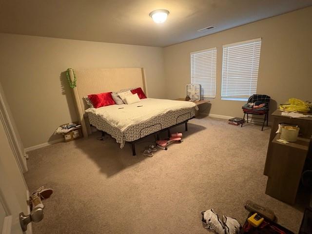 357 Indian Lake Trail Villa Rica, GA 30180 - Photo 7 of 26 a bedroom with a bed and wooden floor