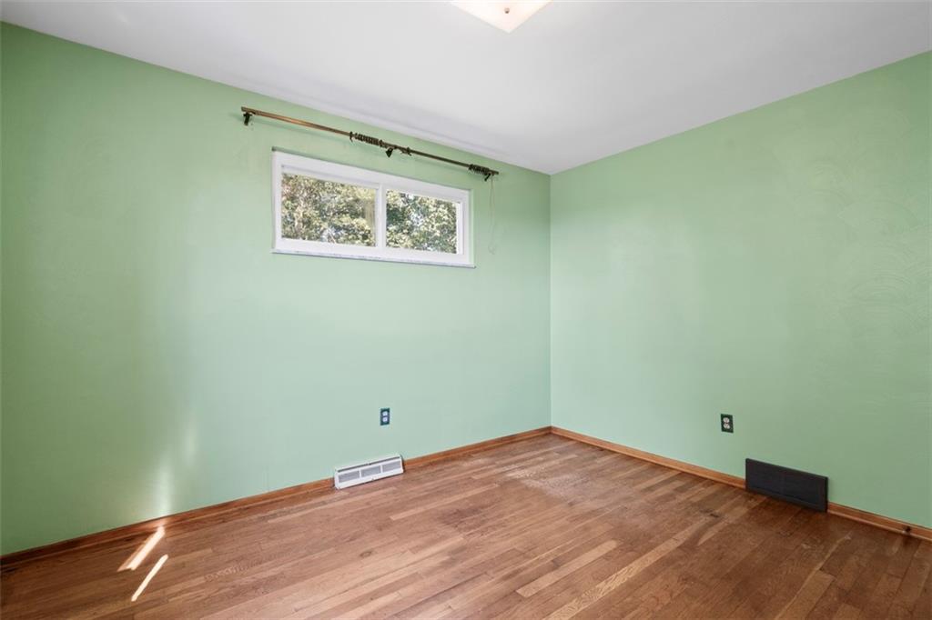 152 Malcolm Pittsburgh, PA 15214 - Photo 22 of 31 a view of a room with wooden floor and white walls