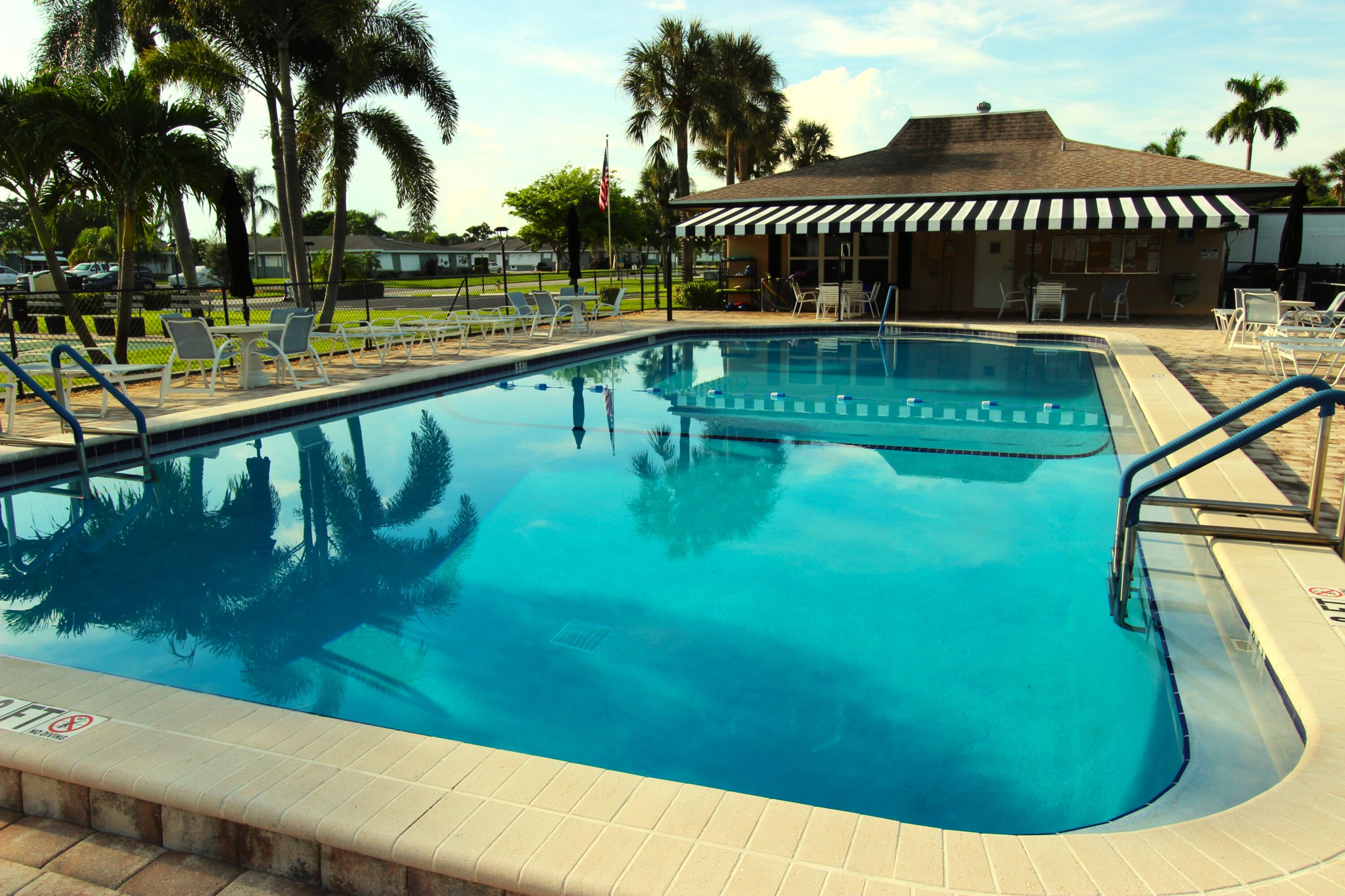 1045 East Circle Terrace, Unit B Delray Beach, FL 33445 - Photo 1 of 12 a view of swimming pool from a balcony