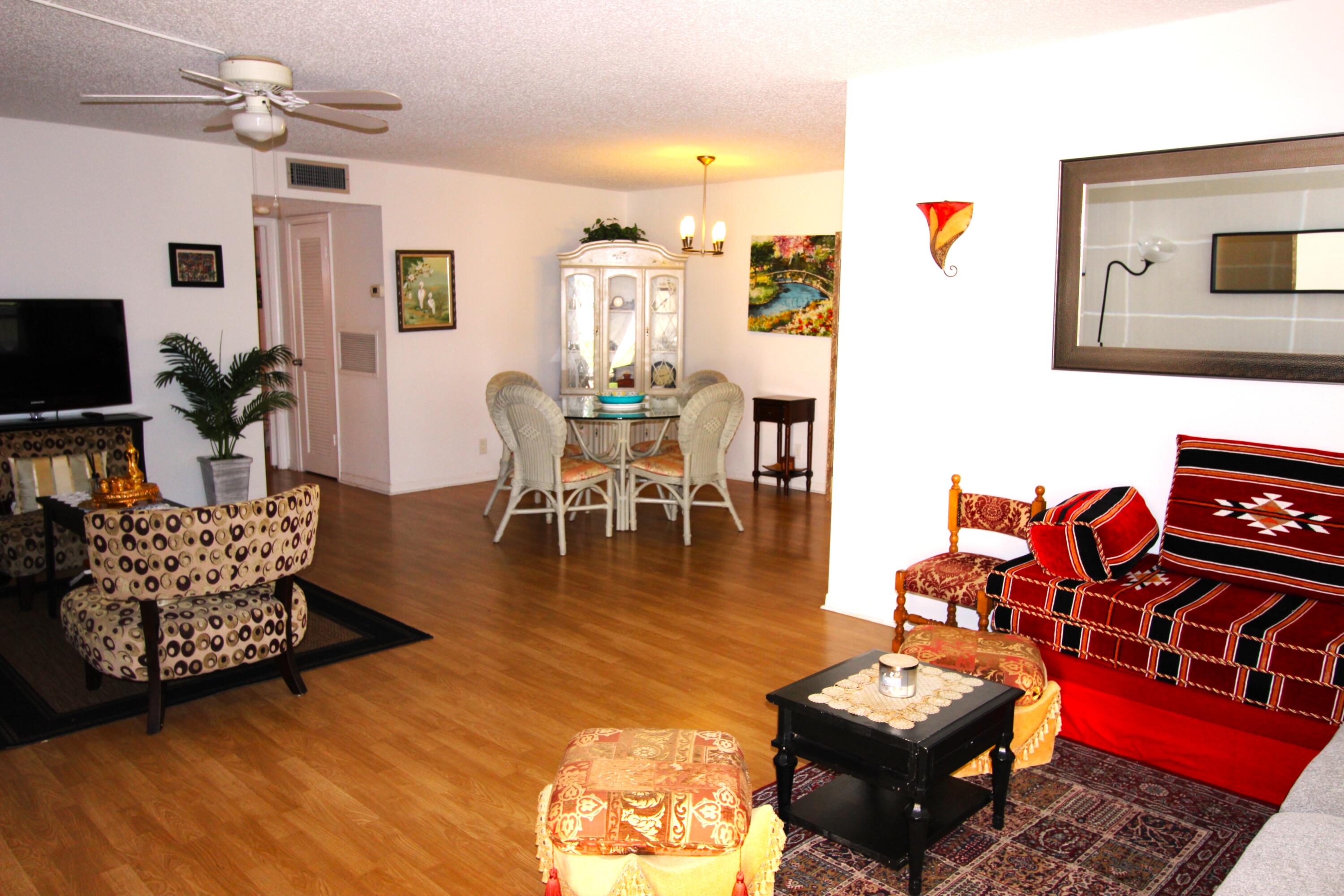 1045 East Circle Terrace, Unit B Delray Beach, FL 33445 - Photo 5 of 12 a living room with furniture and wooden floor
