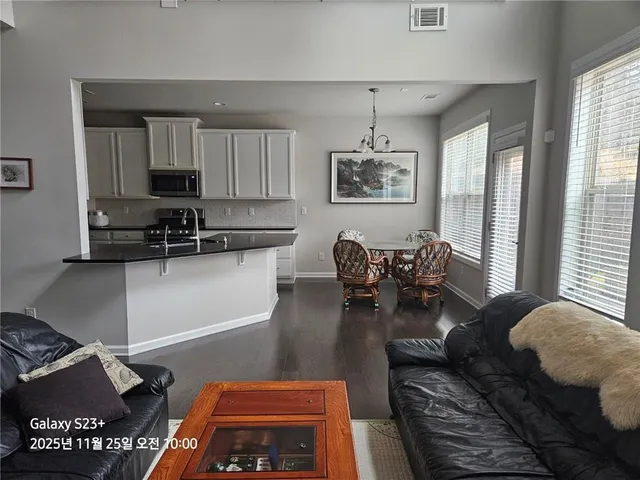 a living room with furniture and a window