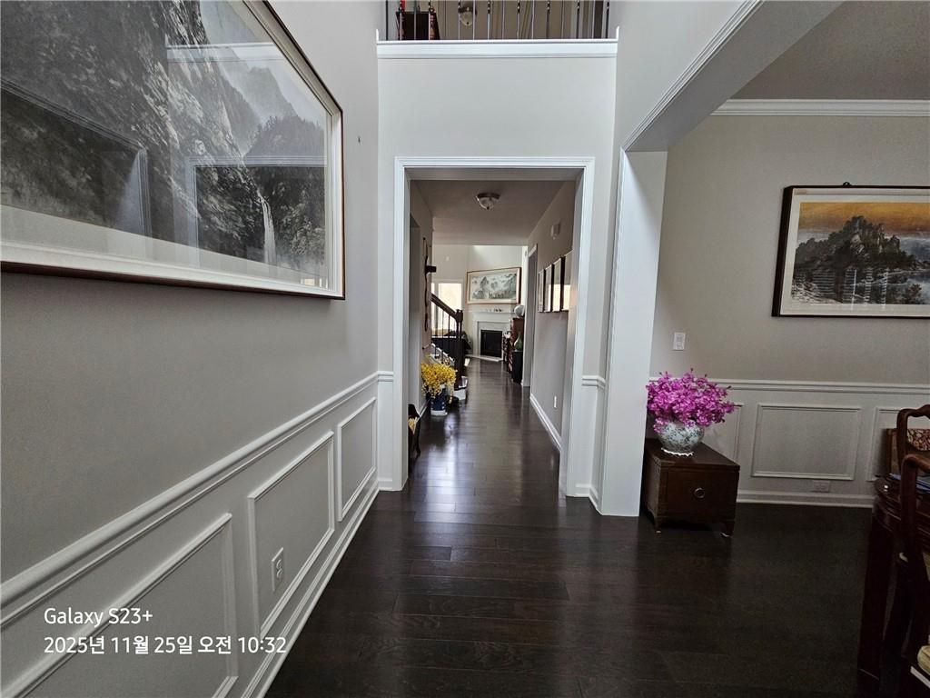 1909 Lakeview Bend Way Buford, GA 30519 - Photo 20 of 30 a hallway with wooden floor and stairs