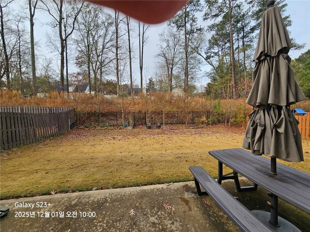 1909 Lakeview Bend Way Buford, GA 30519 - Photo 3 of 30 a view of swimming pool with a bench and trees